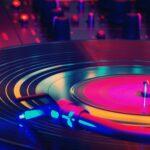 A stylized photo of a record on a turntable, with colorful lights in various places